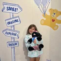Build-A-Bear Workshop - Cora holding her pup named crystal diamond