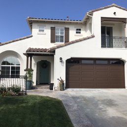 Exterior house paint, stucco, garage door, wood trim, iron railings Exterior house paint, stucco, garage door, wood trim, iron railings