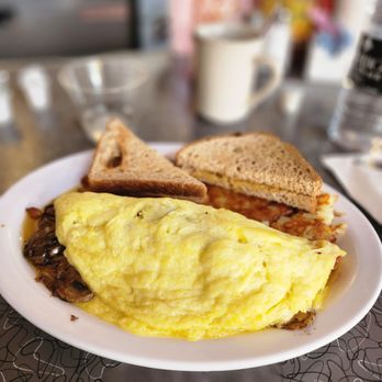 Clover Grill - an omelet and sandwich on a plate - Diners Near Me - New Orleans, Louisiana