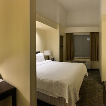 SpringHill Suites by Marriott Corona Riverside - The living room and bedroom connect with a wall in between and the tv places awkwardly in the middle in front of wall. - Venues & Event Spaces Near Me - Corona, California