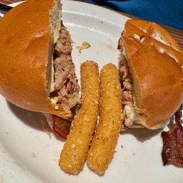 Tush Push burger with mozzarella sticks on the side Tush Push burger with mozzarella sticks on the side