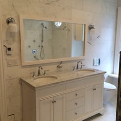 KEP Construction - Our vanity and wall mounted toilet against entire tiled wall!