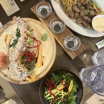 AMA Sushi - Our spread: seaweed salad, crumble roll, beef steak habachi with noodles, sake flight #4 - Sushi Bars Near Me - Edina, Minnesota AMA Sushi - Our spread: seaweed salad, crumble roll, beef steak habachi with noodles, sake flight #4 - Sushi Bars Near Me - Edina, Minnesota