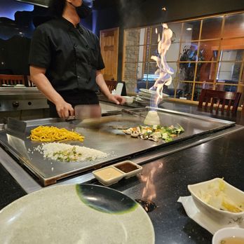 Hokkaido - a chef preparing food in a restaurant - Asian Fusion Near Me - Peoria, Illinois