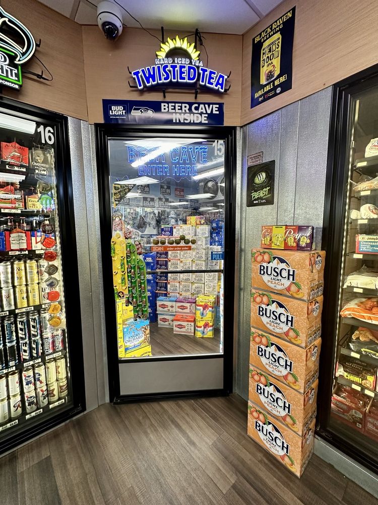 Orting Food Mart & Liquor Logo