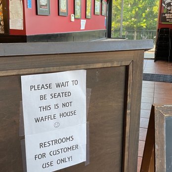 Catch 22 Gastropub - a sign on a bar - New American Near Me - Athens, Georgia