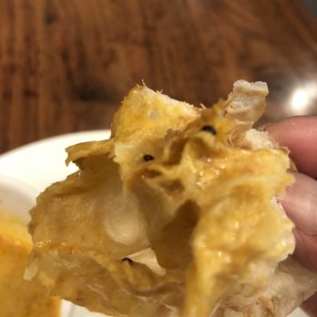 Ipoh Kopitiam - Roti dipped in plain curry, mmm...delicious, wish they give you more than just 2 pieces for the price - Malaysian Near Me - Alhambra, California Ipoh Kopitiam - Roti dipped in plain curry, mmm...delicious, wish they give you more than just 2 pieces for the price - Malaysian Near Me - Alhambra, California