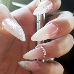 Natural ombre stiletto nails with glitter and gems. Amazing work by Tony