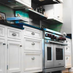 The Kitchen and Bath Works - Crisp white inset cabinets on Caroline St. in Fredericksburg, Va.