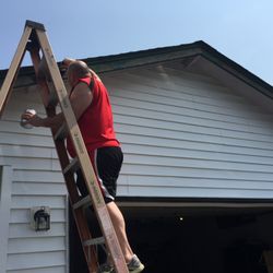 Duncks General Contractors - Painting trim on house