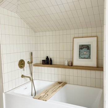 Garcia Tile - a bathtub with a wooden shelf above it - General Contractors Near Me - Santa Clara, California Garcia Tile - a bathtub with a wooden shelf above it - General Contractors Near Me - Santa Clara, California