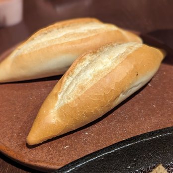 Pho Ha Noi - Two baguettes, served alongside the bò né. - Vietnamese Near Me - Milpitas, California