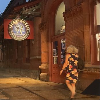 Jazz Showcase - Many people walk to the bright entryway in the evening - Jazz & Blues Near Me - Chicago, Illinois