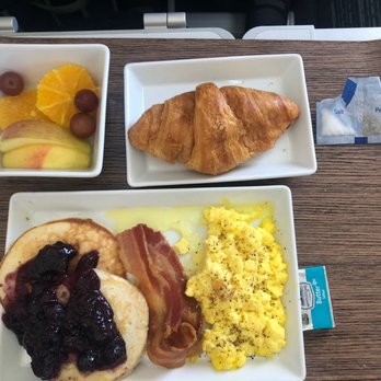 Alaska Airlines - Breakfast - pancakes with blueberry compote and scrambled eggs - Airlines Near Me - Seattle, Washington Alaska Airlines - Breakfast - pancakes with blueberry compote and scrambled eggs - Airlines Near Me - Seattle, Washington
