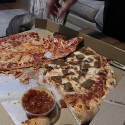 Toss 'N Sauce Italian Pizzeria - Putting the cheese back on the pizza