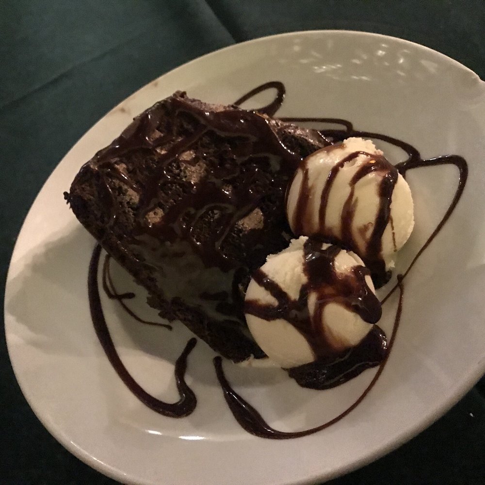 Susanna's - Chocolate cake with two scoops of vanilla ice cream to finish off an amazing meal - American Near Me - Rosarito, BCN