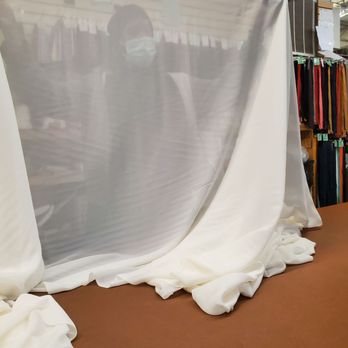 Fabric Joint - Staff measuring and displaying fabric so the bride could decide via phone. - Fabric Stores Near Me - Decatur, GA, Georgia Fabric Joint - Staff measuring and displaying fabric so the bride could decide via phone. - Fabric Stores Near Me - Decatur, GA, Georgia