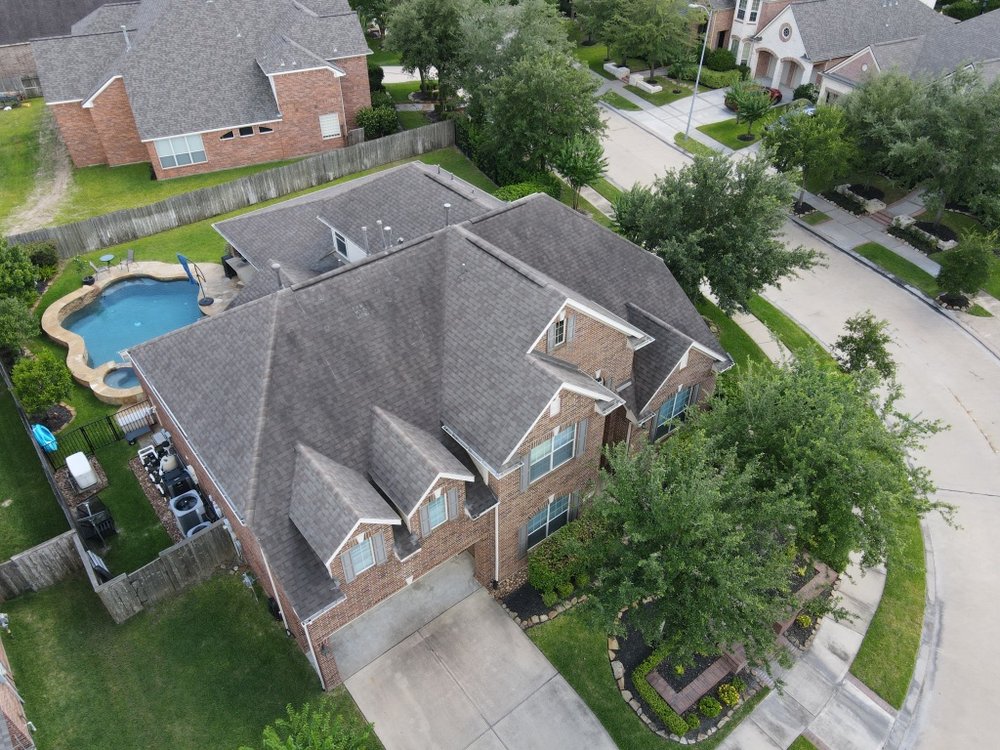 Slide of Moss Roofing Houston