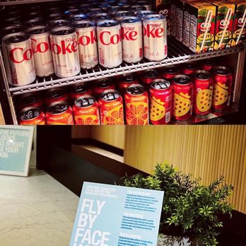 Chase Sapphire Lounge - Top- mini fridge at bev bar with sodas and juice Bottom- facial menu at the "spa" reservation desk - Lounges Near Me - New York, New York