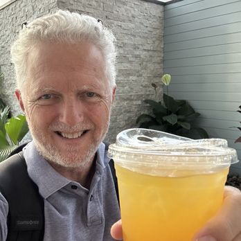 Coffee Window Waikiki - Me in the lobby of the Pacific Monarch slurping down the amazing mango Hawaiian lemonade. - Coffee & Tea Near Me - Honolulu, Hawaii