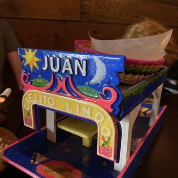 Cielito Lindo - Light and crispy tortilla chips presented with refried beans and salsa in this brightly coloured "boat" - Mexican Near Me - Vancouver, British Columbia