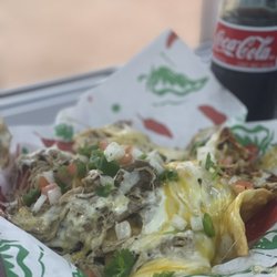 Gringo’s Tacos - Loaded Pork Nachos.  Fresh made tortilla chips smothered in a three cheese blend with our slow cooked premium pork.