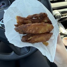 Onion rings cooked longer than needed.