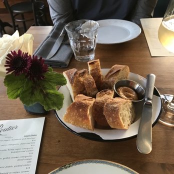 Routier - Table setting prior to ordering our dinner...bread from b.Patisserie (next door) and a glass of Crémant d'Alsace Brut - French Near Me - San Francisco, California