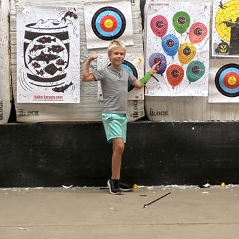 Rhyno's Axe Throwing & Archery - My kid was very excited he got almost got a bullseye - Axe Throwing Near Me - Orem, Utah