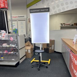 Staples - where you sit for your passport photo to be taken