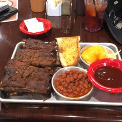 Pork Belly's Eatery and Catering - Ribs (full rack), baked beans, funeral potatoes, side of sauce.