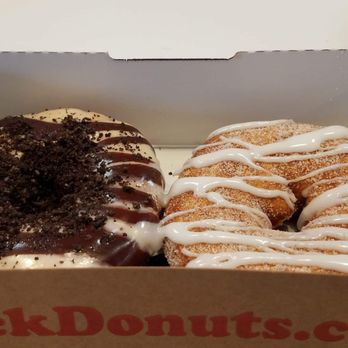 Duck Donuts - Peanut Butter Paradise (peanut butter icing, with chocolate drizzle and added Oreos) and Cinnamon Sugar with vanilla drizzle - Donuts Near Me - Chandler, Arizona Duck Donuts - Peanut Butter Paradise (peanut butter icing, with chocolate drizzle and added Oreos) and Cinnamon Sugar with vanilla drizzle - Donuts Near Me - Chandler, Arizona