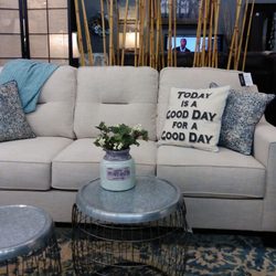 Model Home Furnishings - Lewiston - Neutral sofa with fun pillows