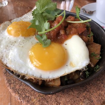 Mildred's Temple Kitchen - Big Brunch Skillet: Spicy pulled pork, roasted onions, black beans and potato hash with two sunny side up eggs and piri piri sauce - Breakfast & Brunch Near Me - Toronto, Ontario Mildred's Temple Kitchen - Big Brunch Skillet: Spicy pulled pork, roasted onions, black beans and potato hash with two sunny side up eggs and piri piri sauce - Breakfast & Brunch Near Me - Toronto, Ontario