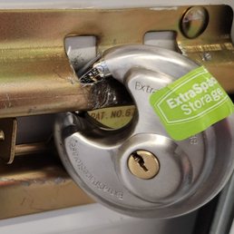 Our damaged lock on our unit with a dummy lock attached.