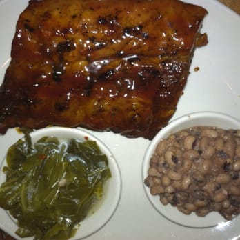 The Pit - Half rack baby back ribs, collards and black eyed peas. Ribs have great smoke and slightly sweet molasses glaze. Tons of meat! - Barbeque Near Me - Raleigh, North Carolina The Pit - Half rack baby back ribs, collards and black eyed peas. Ribs have great smoke and slightly sweet molasses glaze. Tons of meat! - Barbeque Near Me - Raleigh, North Carolina