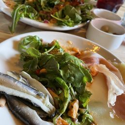 Jamon, octopus salad, and sardines.