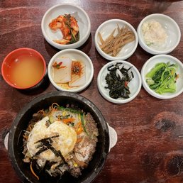 Banchan. The kimchi is made in house and it's wonderful. Sometimes they have spicy braised tofu that's fantastic, too.