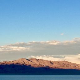 Sun starting to set; the mountains behind me casting a shadow across the lake was gorgeous. Sun starting to set; the mountains behind me casting a shadow across the lake was gorgeous.