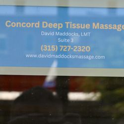 Concord Deep Tissue Massage - Placard on front door, left side