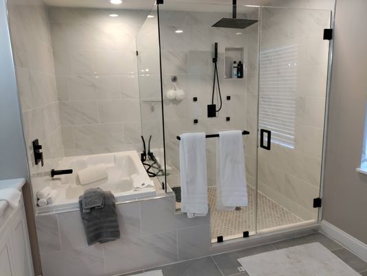 Bathroom - We enlarged the shower by turning the tub 90 degrees and added a bench seat and niche in the shower.