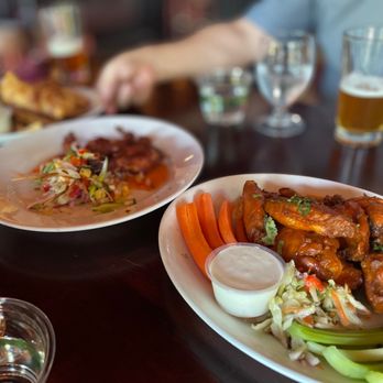 Art Marble 21 - two plates of food on a table - Cocktail Bars Near Me - Seattle, Washington