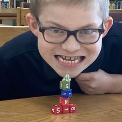 Ben Hill Middle School - Man with suspiciously shaped dice tower