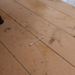 Jellystone Park- Chincoteague Island - Outdoor table filthy used q-tips left behind black sut/ash all over table