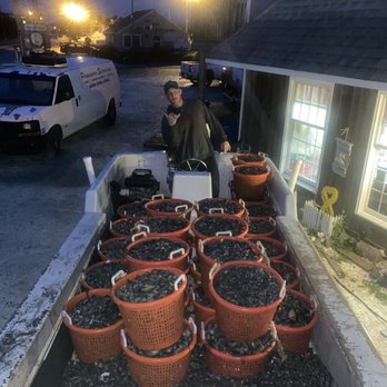 Parsons Seafood - a man standing in front of a row of potted plants - Seafood Markets Near Me - Tuckerton, New Jersey Parsons Seafood - a man standing in front of a row of potted plants - Seafood Markets Near Me - Tuckerton, New Jersey