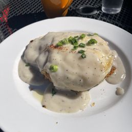 Chicken and biscuits smothered in gravy. Chicken and biscuits smothered in gravy.