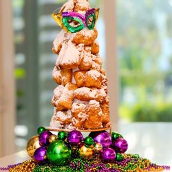 Baton Roux - A stacked tower of hot, pillowy New Orleans-style beignets dusted with powdered sugar. Perfect for sharing and special events.