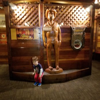 Cattlemens - Our little one decided to sit next to a wooden cowboy - Steakhouses Near Me - Selma, California