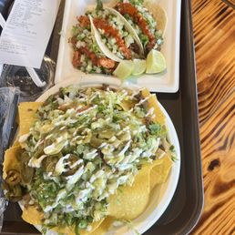 Nachos Fiesta and three street tacos Nachos Fiesta and three street tacos