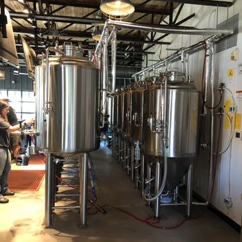Untamed Waters Brewing - a man working in a brewery - Breweries Near Me - Fort Mill, South Carolina Untamed Waters Brewing - a man working in a brewery - Breweries Near Me - Fort Mill, South Carolina